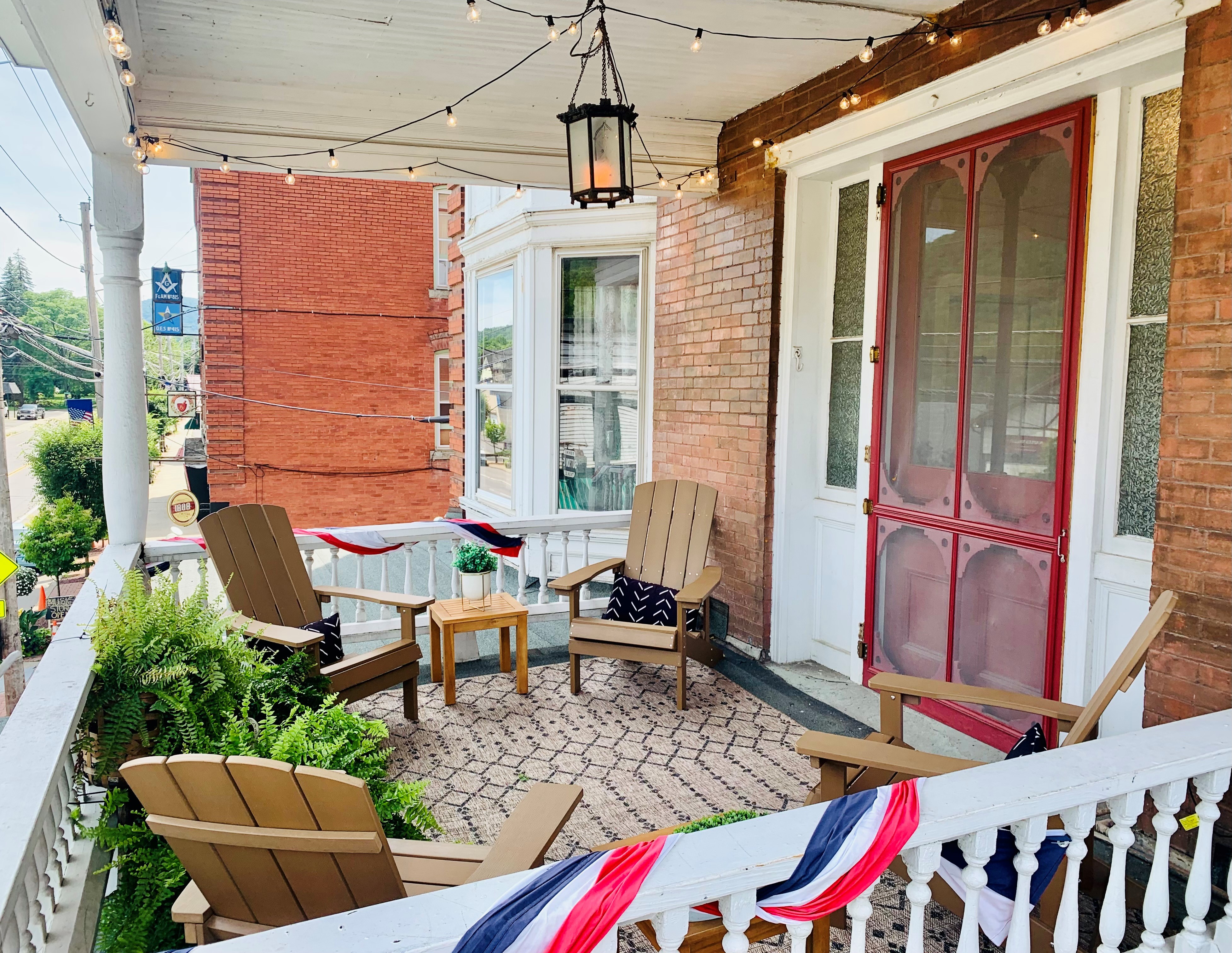 Upper porch with string lights
